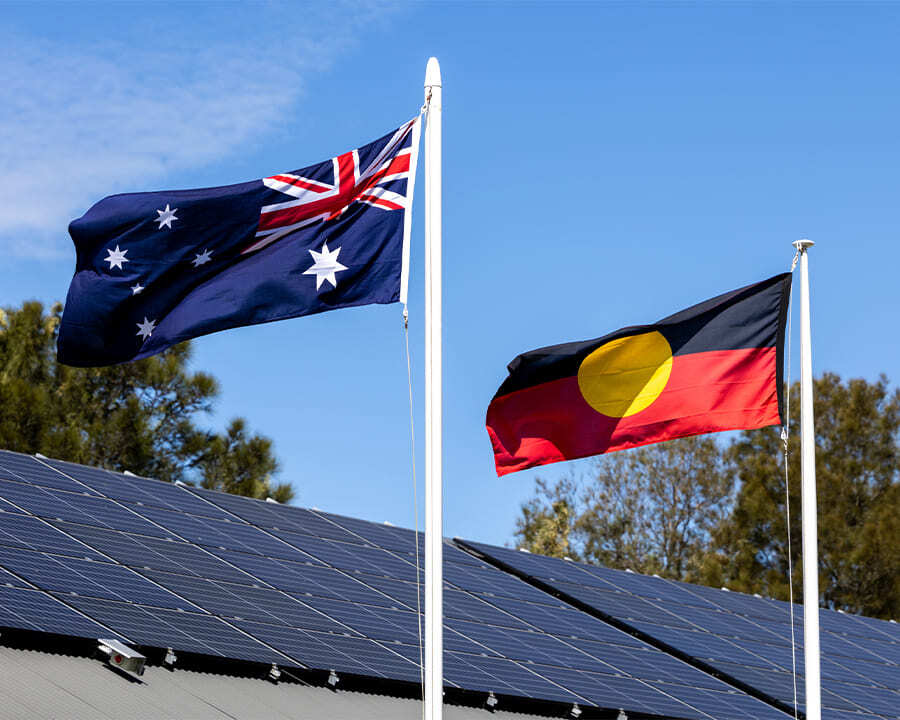 Australian and aboriginal flags waving