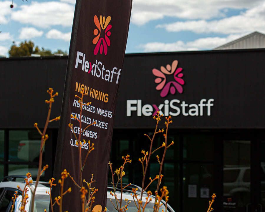 A FlexiStaff flag in front of their storefront