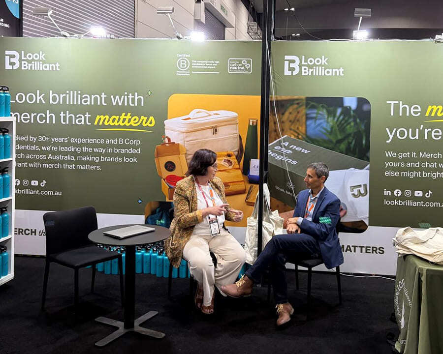 A Look Brilliant employee talking to a client in an expo booth