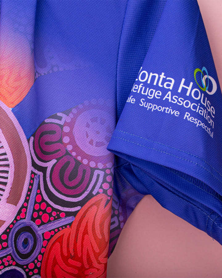 Close-up of a custom designed work uniform for Zonta House