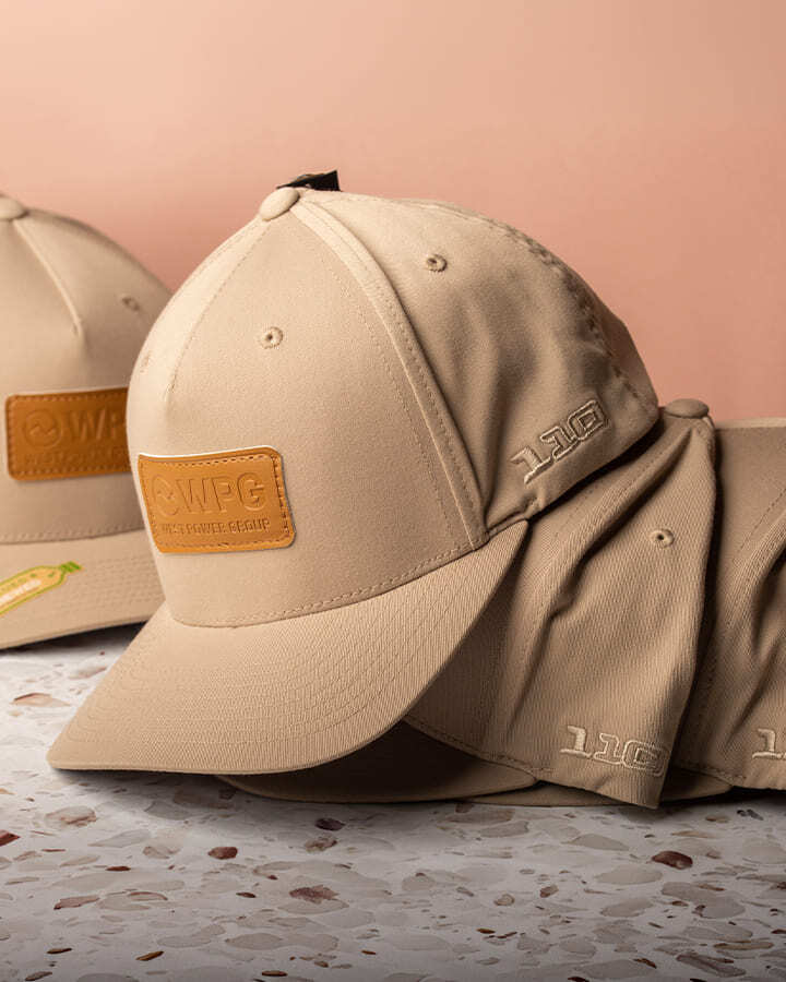 Stack of Western Power Group caps