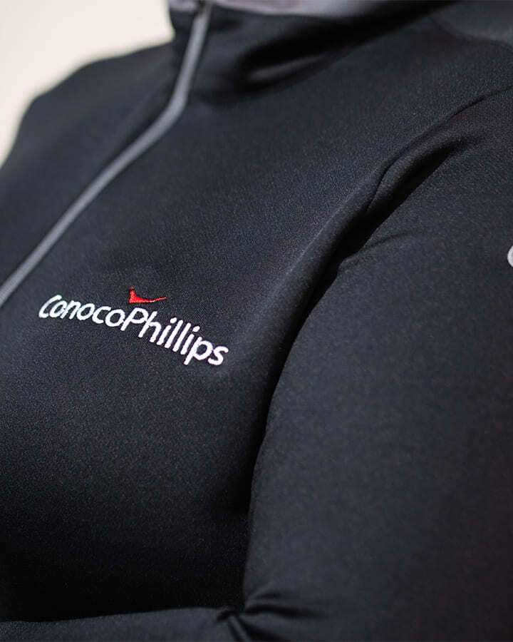 Close-up of a person wearing a Conoco Phillips branded jacket