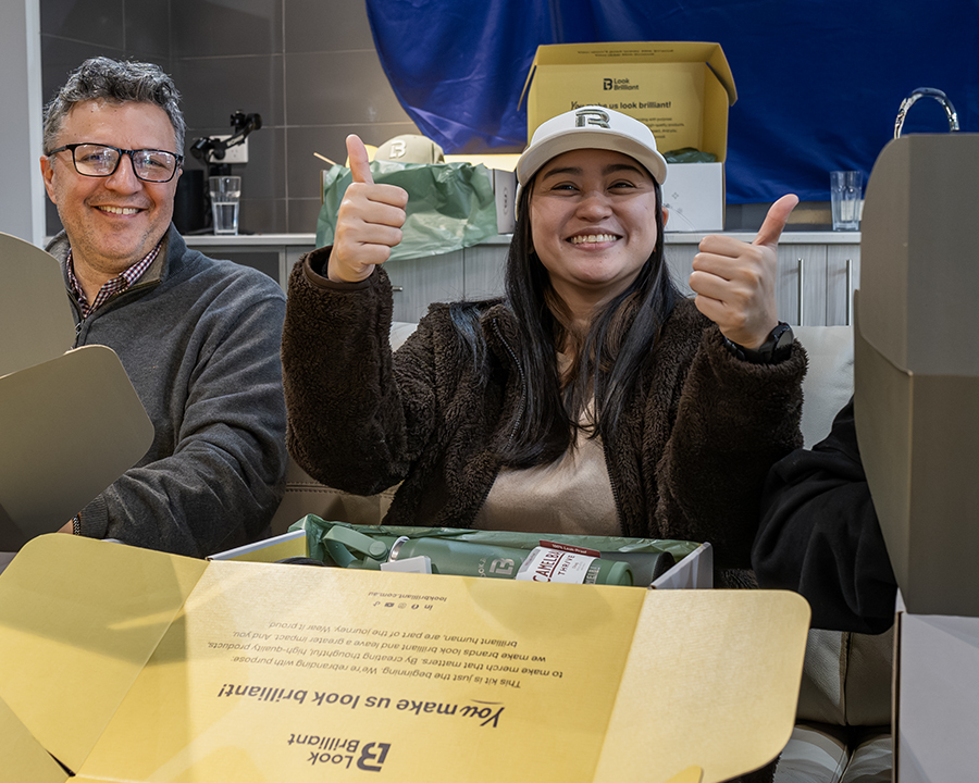 Two smiling Look Brilliant employees