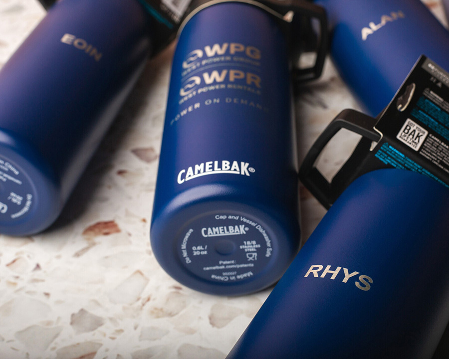 A close-up of blue branded camelbak water bottles