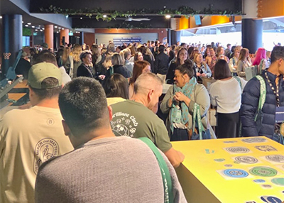 Large crowd of people gathering around the look brilliant activation at state of social 2025