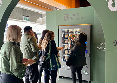 Crowd lining up to try look brilliant vending machine activation