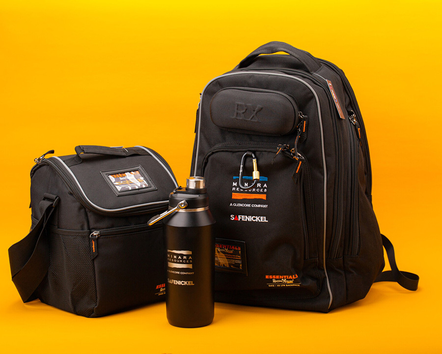 Two black bags and a bottle