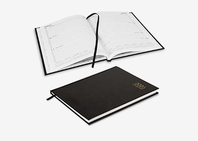 Two black planners, one is open, displaying a weekly layout with a black bookmark, while the other is closed