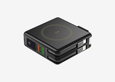 A compact black power bank with multiple charging ports including USB and USB-C