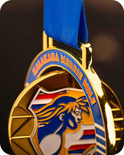 Golden medal with a blue ribbon, featuring a silhouette of a running figure with flowing hair