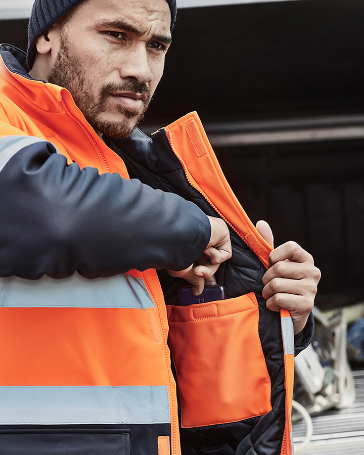 Man wearing orange high visibility jacket