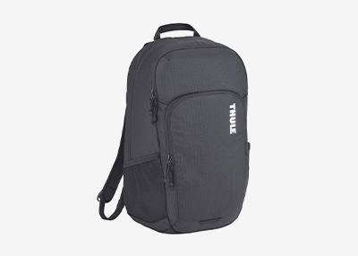 A sleek black Thule backpack with multiple zippers and compartments