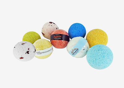 A variety of colourful bath bombs are arranged together