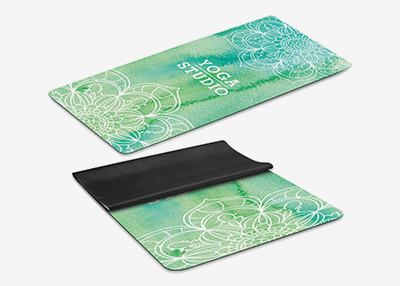 Yoga mats with teal mandala designs, one rolled open