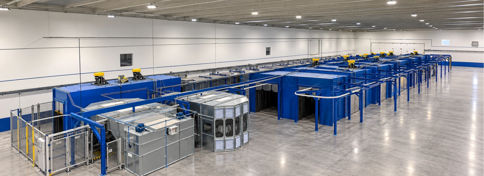 Integrated industrial finishing line with surface pretreatment, dry-off oven, coating application equipment, and curing oven