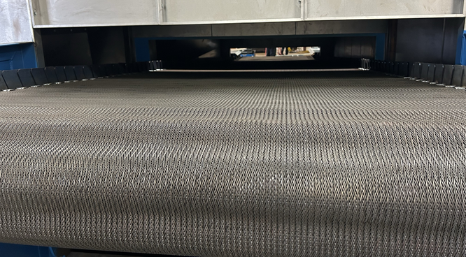 Custom engineered conveyor oven with chain driven mesh belt manufactured by Horizon Performance Technologies.