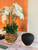 Large teak bowl with white orchids
