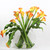 Moon vase with mango calla lilies