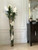 White Vanda Orchids And Driftwood Inside Oversized Tapered Glass Cylinder