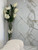 White Vanda Orchids And Driftwood Inside Oversized Tapered Glass Cylinder