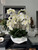 White Phalaenopsis  Orchids in  White Open Hands Sculpture Vase