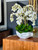 White Phalaenopsis  Orchids in  White Open Hands Sculpture Vase