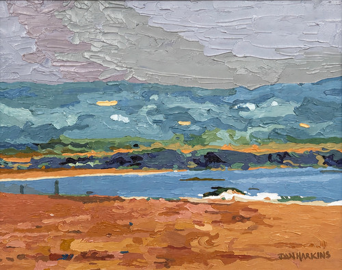 Horizontal impressionist oil landscape painting of a sandy beach and a blue ocean under a heavy gray sky by Dan Harkins