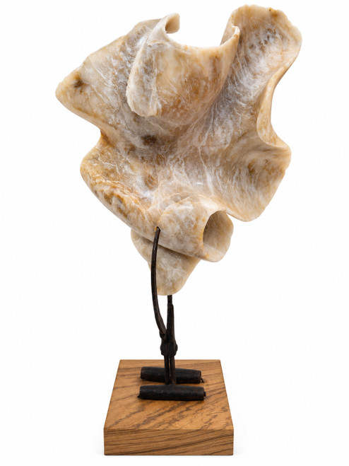 Vertical multi-angle views of the contemporary mixed media sculpture 'On the Tip of My Tong' featuring a translucent white alabaster stone ribbon gripped in antique iron ice tongs on a zebrawood base by Rebecca Robinson