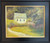 Impressionist oil painting of a white cottage with a picket fence and flower garden next to a winding path by Marilyn Farnsworth Wendling.