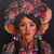 "Original 12x12 square oil on canvas painting titled Tibet by Elouise Lane Quadros, depicting a realistic portrait of a young Tibetan woman in ornate traditional headdress and dress against a black background."