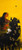 Vertical mixed media painting of a terracotta red woman and a small white goat under a bright yellow sky by a dark tree.