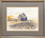 Framed horizontal watercolor painting of a scarecrow in a plowed brown field before an old gray farmhouse by John E. Harris.
