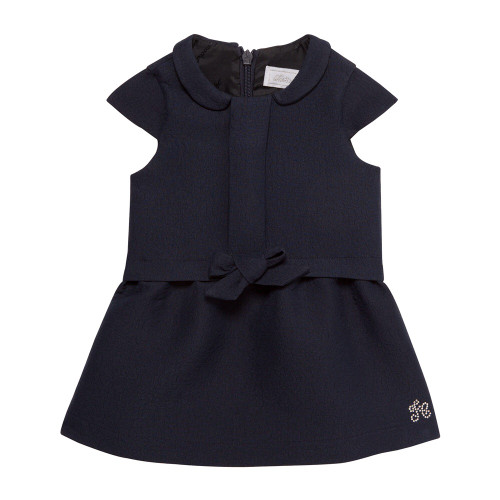 Tartine et Chocolat navy dress with bow on front.