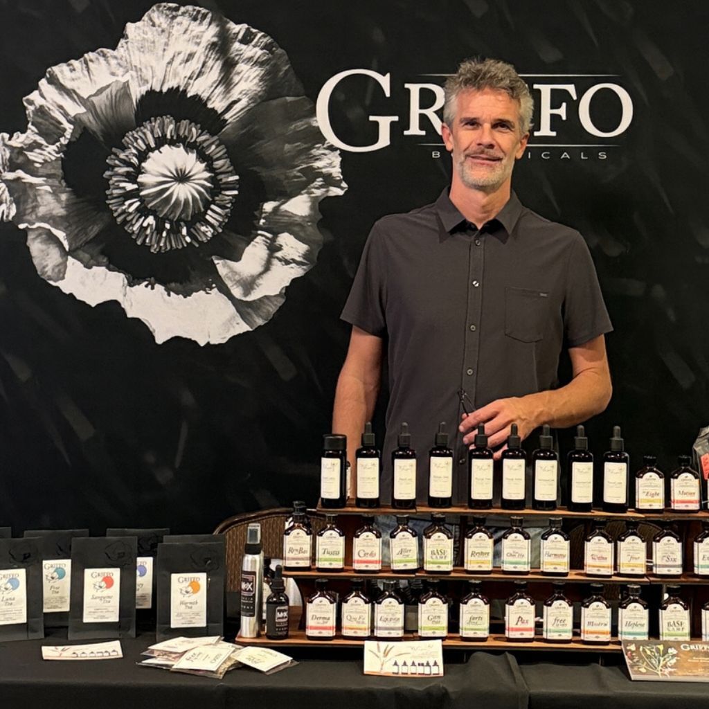 Frank Griffo, L.Ac. in front of his product line