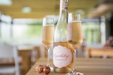 Bottle of Leopard's Leap 'Sparkling' Chardonnay Pinot Noir, Western Cape NV with citrus and brioche. Bottle of wine next to glasses of sparkling wine.