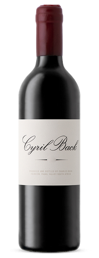 Bottle of Fairview 'Cyril Back' Shiraz, Coastal Region 2017, red wine with notes of blackberry, plum, spice and oak. Bottle of wine next to glass of red wine and decanter.