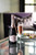 Bottle of Steenberg 1682 Brut Pinot Noir, Constantia NV sparkling wine with fresh berry and citrus. Bottle of sparkling wine next to glass of sparkling wine and plate of food.