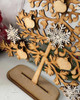 MDF Floral Christmas Tree MDF Wood Blank Craft Kit – Christmas Holiday Home Décor, close-up view of the wooden tree with white and natural-colored snowflakes and bird-shaped cutouts for holiday decoration.