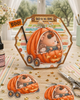 Cute bear and mouse pumpkin car Halloween black and white digital stamp featuring woodland animals riding in a jack-o'-lantern pumpkin vehicle with bat steering wheel, hanging dice and pumpkin wheels.