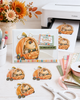 Cute bear and mouse pumpkin car Halloween black and white digital stamp featuring woodland animals riding in a jack-o'-lantern pumpkin vehicle with bat steering wheel, hanging dice and pumpkin wheels.