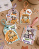 Cute bear and mouse pumpkin car Halloween black and white digital stamp featuring woodland animals riding in a jack-o'-lantern pumpkin vehicle with bat steering wheel, hanging dice and pumpkin wheels.