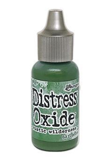 Rustic Wilderness  Distress Reinker - Tim Holtz. Re-Inkers can be used to re-ink Distress Ink Pads, which are sold separately. Is your inkpad going dry? Simply drip new ink onto the pad to reinvigorate it again. Eco friendly.
You can also use reinkers to colour - just use a paintbrush with the ink! 
Re-Inkers are available in 0.5oz amber glass bottle with an eye drop applicator Acid Free Non-Toxic Fade Resistant