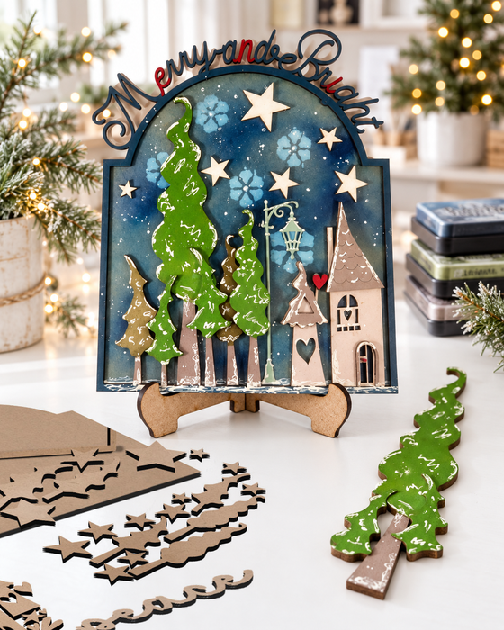 Merry & Bright Wonky Houses MDF wood craft blanks kit - for card making and crafts, mixed media crafting, junk journaling, planner crafts, scrapbooking, home decor crafting, craft fair sellers.

Includes 40 pieces, 3mm MDF:
Wreath measures approx 12"/30cm


Every crafter loves a Wonky MDF house! This MDF kit is fabulously versatile and you'll love decorating this!

Featuring a large Plaque/sign (approx 28cm tall) with a frame featuring the words Merry & Bright this is crying out for decorations and to use around the home or to gift to someone you love. Or - you can also sell this made up at a Craft Fair this season too!

A perfect piece to make a family heirloom that can be treasured for years to come.

Cover the base with card, paper, paints, inks and texture pastes to make it your own or use the pieces individually to get more from your kit. 3mm MDF.