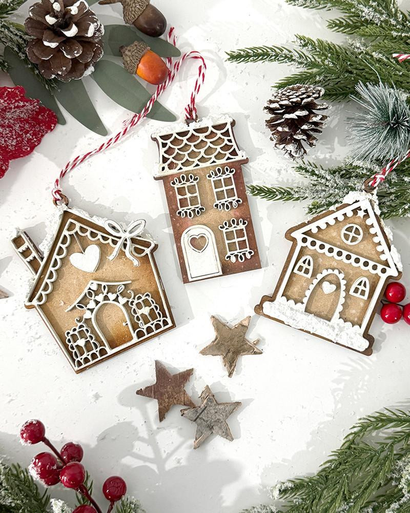 MDF Gingerbread House Bauble Pack - Wood Blank Craft Kit, Home Decor, on a festive holiday background with pine branches, pinecones, stars, and berries.
