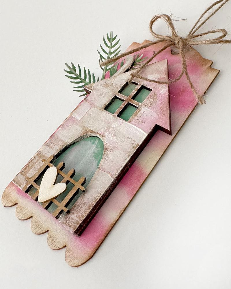 MDF Altered Art MDF Board & Chipboard Tags/Bookmarks Pack - Wood Blank Craft Kit, Home Décor, wooden house-shaped tag with pink and white distress paint, decorative heart and greenery accents.
