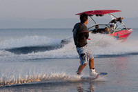 Wakeboarding from an Assault wakeboard tower at the lake.