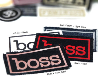 Iron on patches with the word boss on it in a variety of colors.
