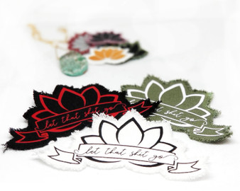 Let that shit go iron on lotus patch in various colors.