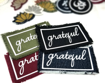 Grateful iron on patches in different colorways and inspirational patches in the background.