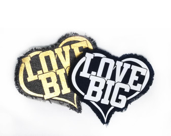 Heart shaped iron on patch with the words Love Big on it.